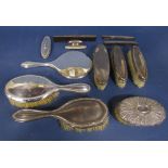 A mixed collection of silver dressing set items comprising five brushes, three silver topped