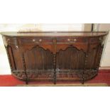 An unusually narrow stained pine dresser base, the frieze fitted with four shallow drawers and