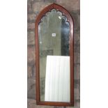 A Gothic style lancet shaped wall mirror with moulded frame, 94 cm high x 35 cm wide