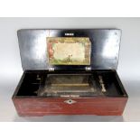 Late 19th century Swiss music box playing eight airs, the simulated rosewood case enclosing an