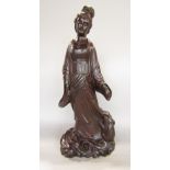 Carved Chinese hardwood figure of a standing Geisha type girl, with a rodent at her feet, 55cm high