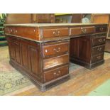 A substantial mahogany partners writing desk with inset leather top, 152cm wide
