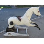 A Ragamuffin rocking horse with painted moulded fibre glass body supported by large coiled springs