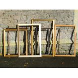 A quantity of picture frames of varying size and design, mainly oak and gilt examples