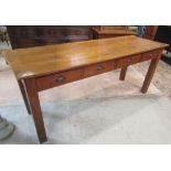 A vintage pine side table, fitted with four frieze drawers, raised on square cut supports, beneath a