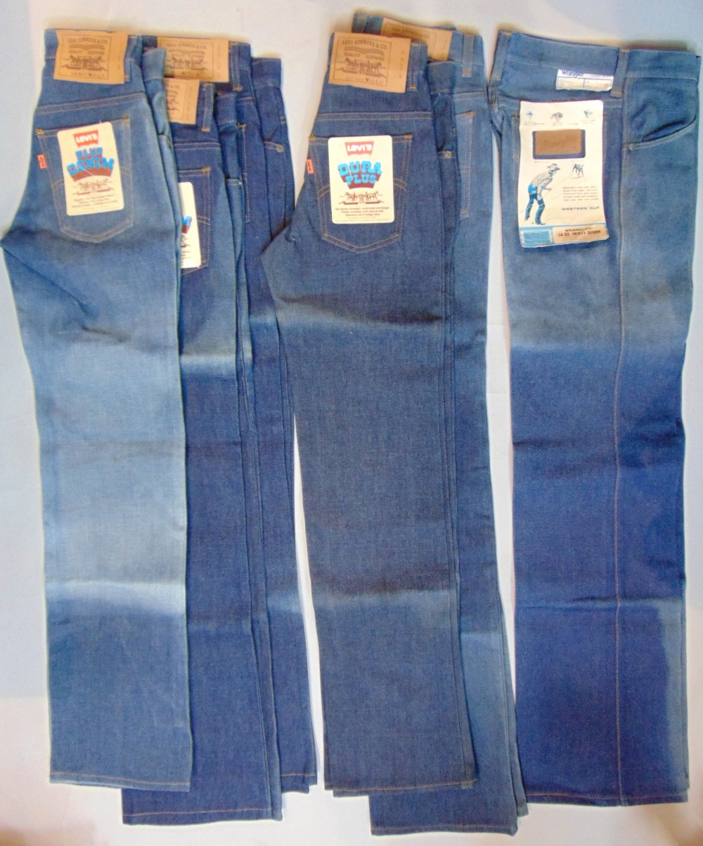 5 pairs of vintage Levi's jeans all unworn, post 1971 and with orange tabs and original labels; 3