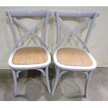 A set of six Bentwood dining chairs with x shaped splats, wicker seats and painted finish