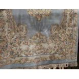 A Chinese type wall country house carpet with typical pastel shades and floral bouquets upon a