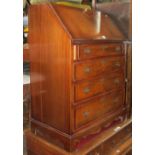 A pair of Edwardian walnut bedside cupboards, each enclosed by a rectangular panel door with