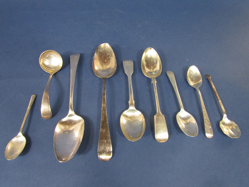 A collection of various silver spoons to include a pair of Georgian Old English table spoons and