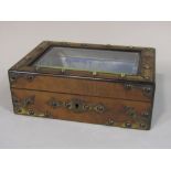 A Victorian walnut and brass overlay jewel box, with plate glass panelled lid and silk lined