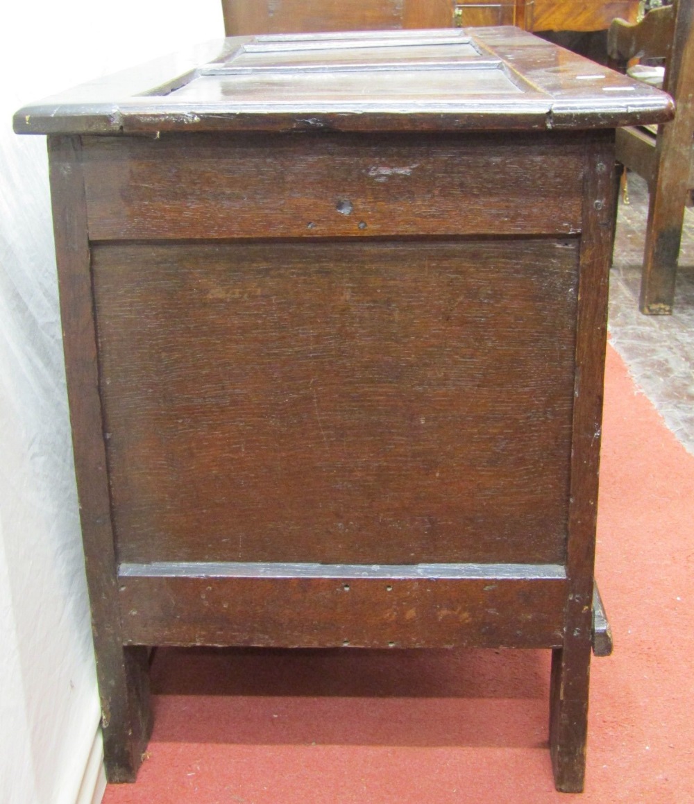 An 18th century oak panelled coffer, the front elevation with repeating Tudor rose and floral - Image 3 of 4