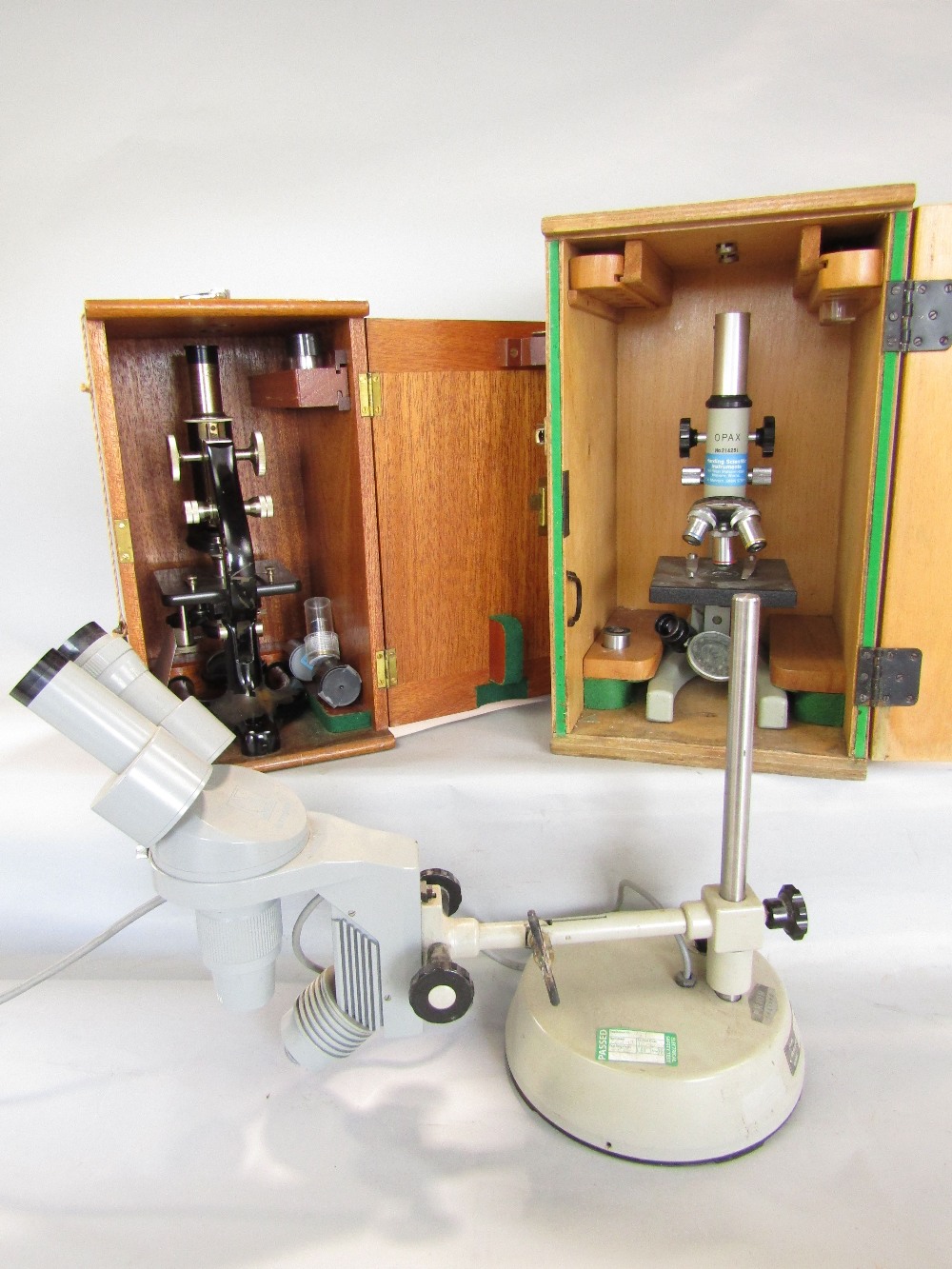 Three microscopes- Opax number 214251, a Prior of London number 12495, both with travel cases and