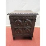 An early crude and heavy oak box, with deeply carved front panel and geometric theme, with
