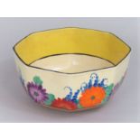 A Clarice Cliff Bizarre Gayday bowl of octagonal form with purple, blue, orange and green floral
