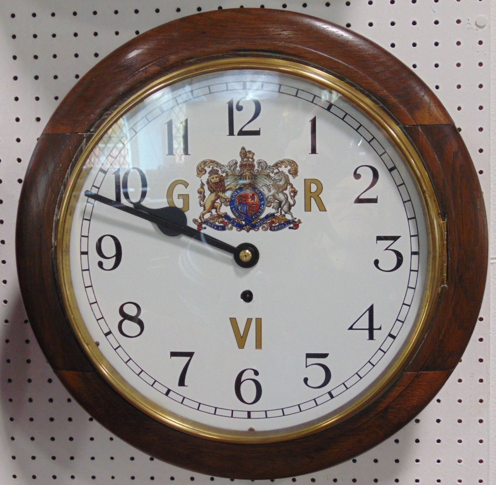 Oak cased 11.5 inch wall clock, with Arabic numerals and polychrome crest for George IV; together