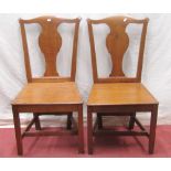 A set of four 3+1 Georgian oak dining chairs with vase shaped splats, solid seats on square cut