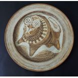 In the manner Bernard Leech - studio pottery charger centrally decorated with a stylised bull,