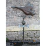 A vintage weather vane, the pole with north, south, east and west, copper arrow pointer and