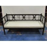 A 19th century continental pine framed settle, the open framework with cross hatched detail with