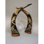 A pair of buffalo horns, with tiger, pheasant and dragon detail