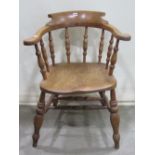 19th century elm and beechwood smokers bow elbow chair with turned spindle back, supports and