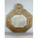 18th century embossed brass wall mirror of octagonal form, the framework with a repeating