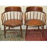 Three similar Edwardian office desk chairs, with bowed turned spindle backs over rexine