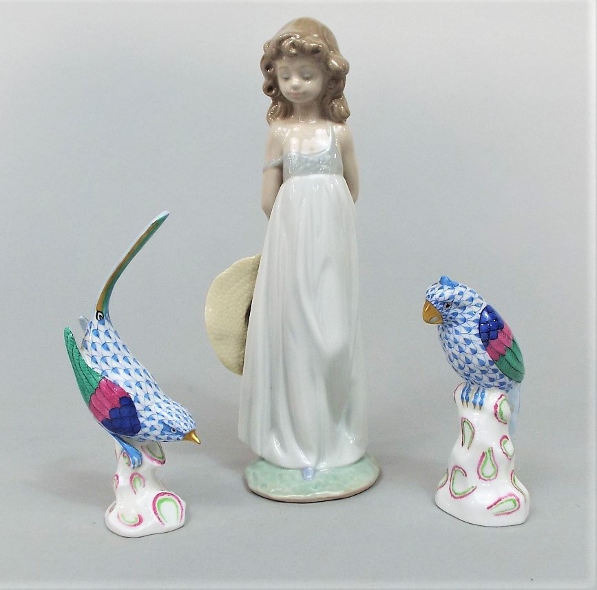 A boxed Lladro Daisa figure from the 2005 Events Creation series of a young girl holding a hat (