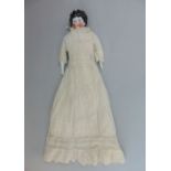 Early 20th century doll with porcelain head, hands and feet, painted features, soft body with