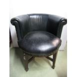 A 1920s office chair with horseshoe shaped back raised on square taper legs and spade feet,