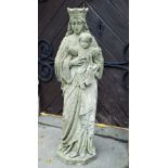 A 19th century weathered carved limestone statue in the form of Madonna and child, with well