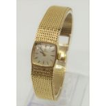 Ladies 9ct Omega cocktail watch, the champagne dial with gilt baton markers upon original mesh