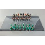 Themed chess set with painted cast metal medieval style figures (possibly Robin Hood) stored in a