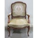 A French salon chair with upholstered seat and padded back, within a shaped, carved and moulded