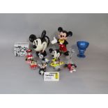A collection of Disney related ceramics including a novelty teapot in the form of Mickey's head by
