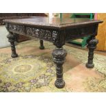 Victorian Gothic revival oak library/writing table fitted with two frieze drawers on four turned