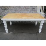 A Victorian style farmhouse kitchen table of rectangular form with stripped top raised on four