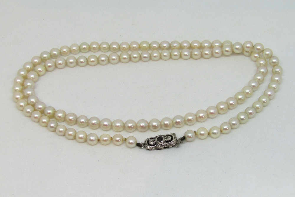 Single strand pearl necklace, the sterling silver clasp stamped 'M' - possibly for Mikimoto (clasp