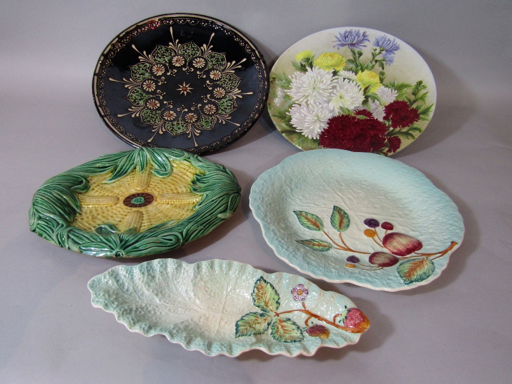 A 19th century majolica type serving plate of oval form, modelled as sweet corn, together with a