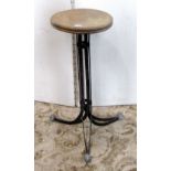 A vintage industrial work stool, with circular elm seat and raised on slatted steel, swept tripod