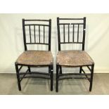 A pair of 19th century ebonised rush seated chairs with simulated bamboo frames