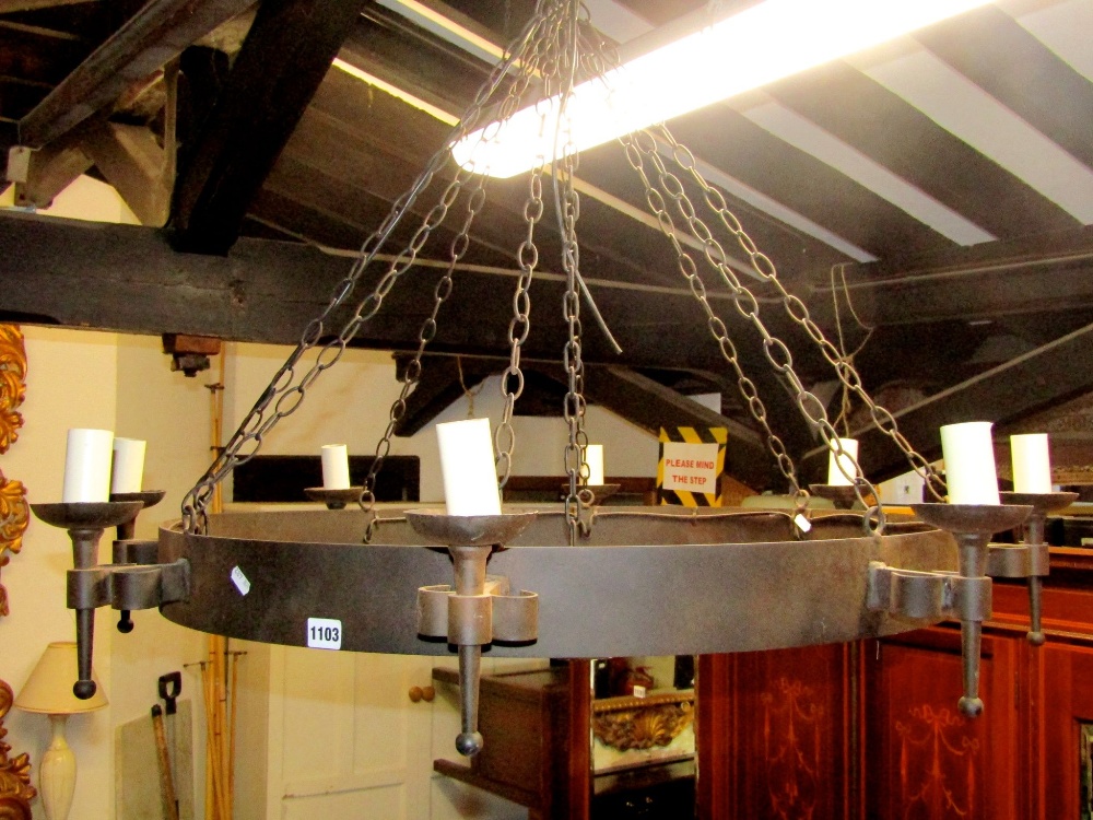 A contemporary old English style iron work hanging ceiling light/electrolier of hooped form with