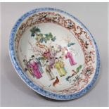 A 19th century oriental bowl with famille rose painted decoration of male characters in a