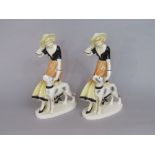 A pair of German ceramic figure groups in the art deco manner, of women with dogs, with printed