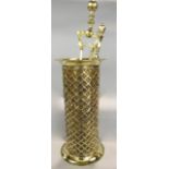A cylindrical polished brass stickstand with basket weave finish together with two polished brass