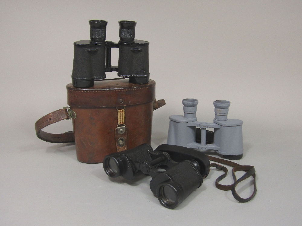 Three pairs of 6 x 30 binoculars maybe German origin, one in case and two pairs with strap and eye
