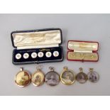 Cased set of three 18ct dress studs, 2.2g total, together with a further cased set of six mother