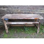 A rustic sturdy pine work bench with through jointed construction, three plank top and Guardsman