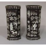 A pair of Chinese lacquered and mother of pearl inlaid vases of square cut form with canted corners